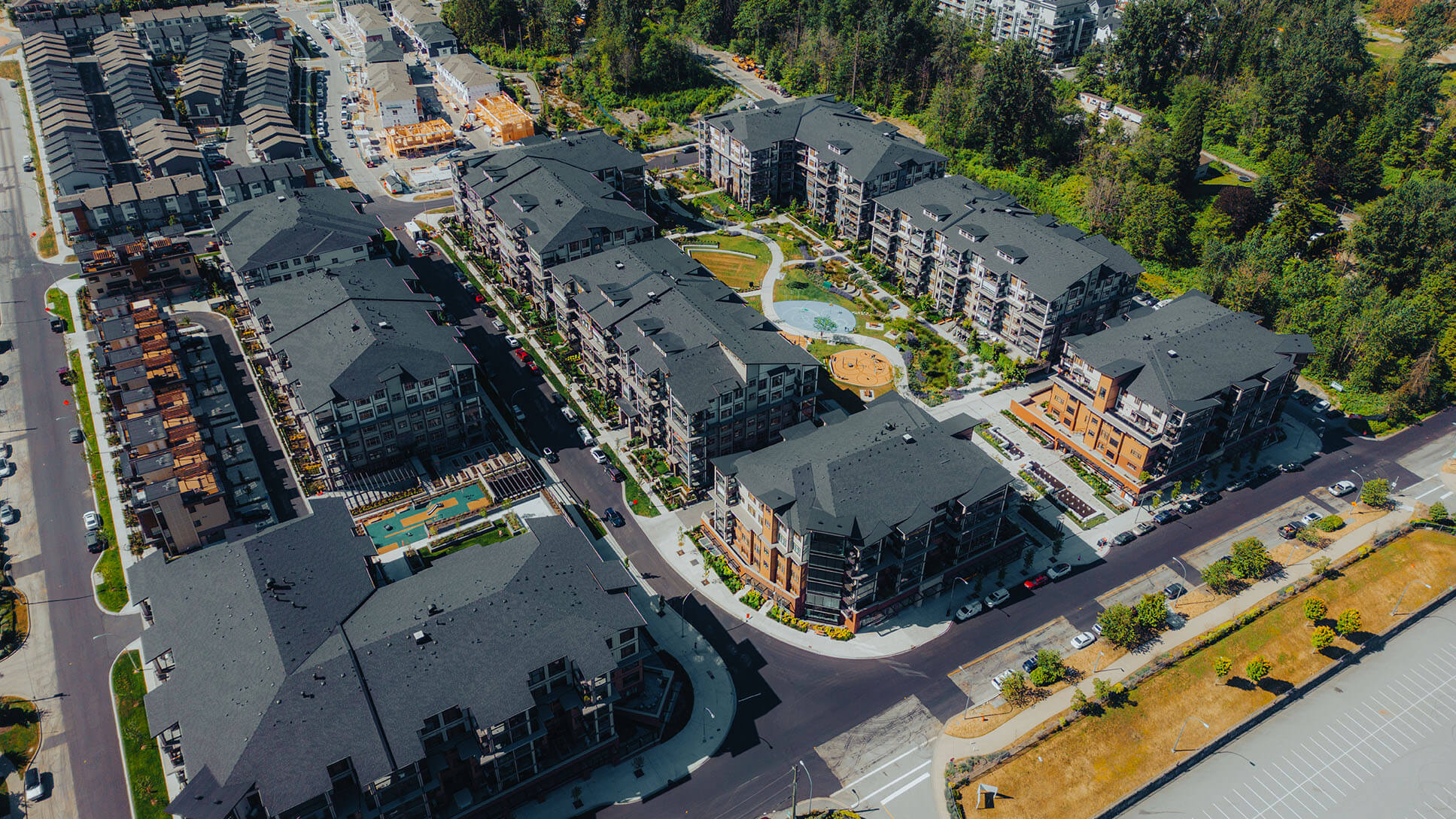 Aerial drone photo of the completed Carvolth multi-residential development in Langley, showing multiple buildings and surrounding area.